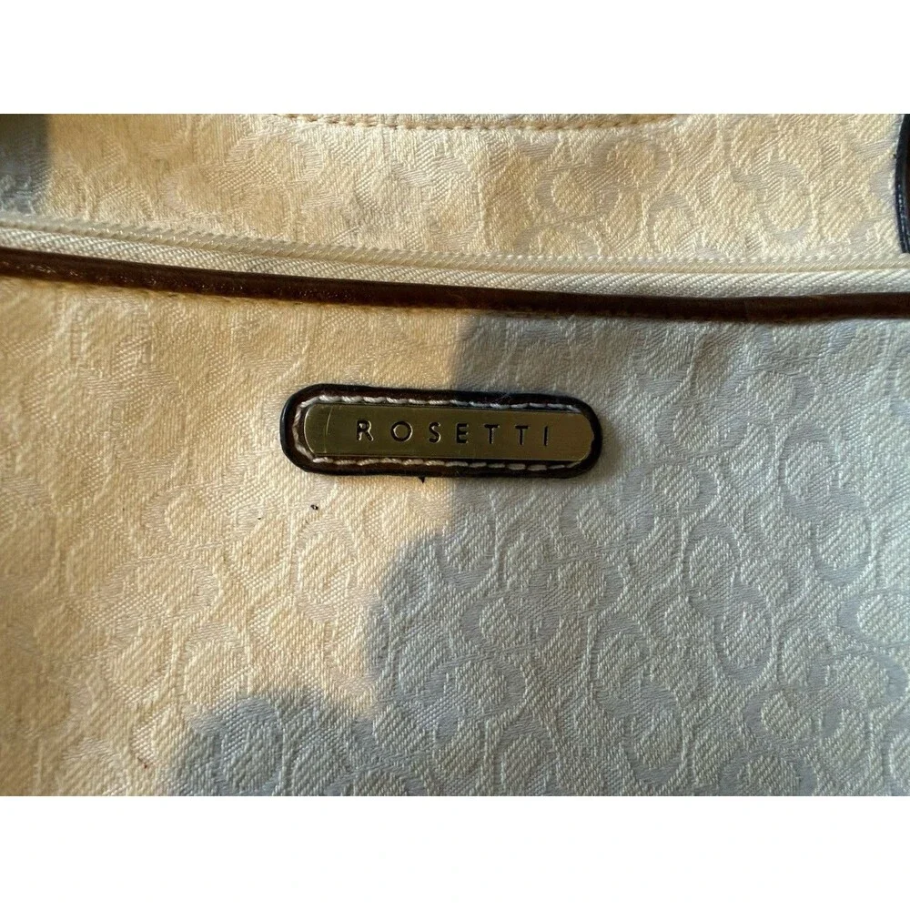 Rosetti shoulder bag with matching wallet in a white and brown color scheme.